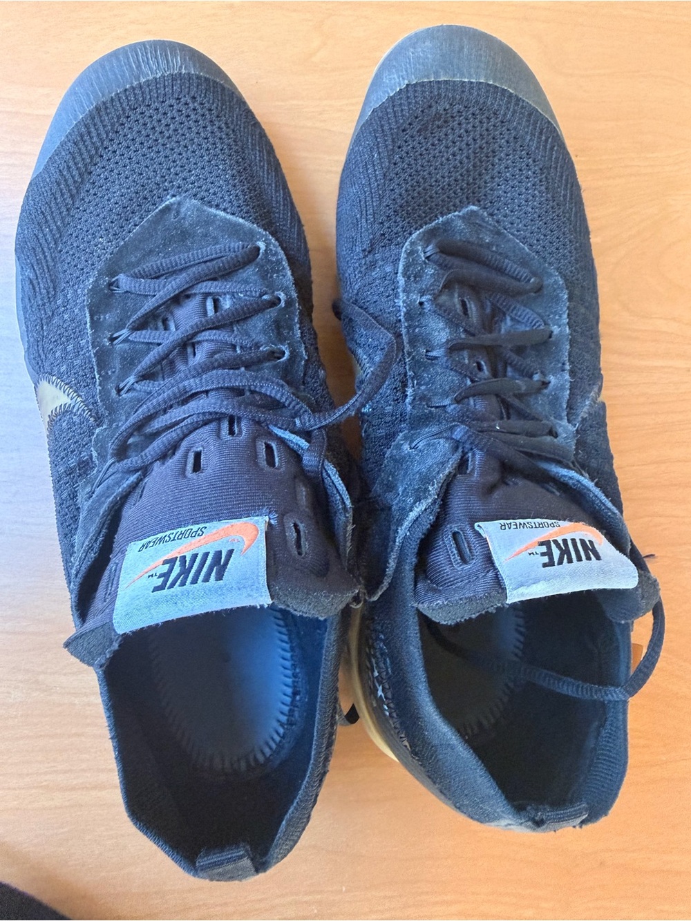 Nike Men’s Black Sneakers with Orange Logo Accent